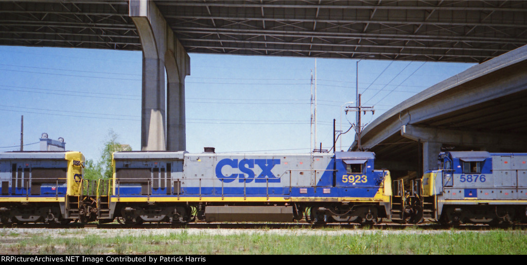 CSX 5890 B36-7 westbound out of CSX Gentilly Yard with CSX 5923 B36-7 and CSX 5876 B36-7 about noon below the I-10 high-rise bridge in New Orleans LA 03-1995
